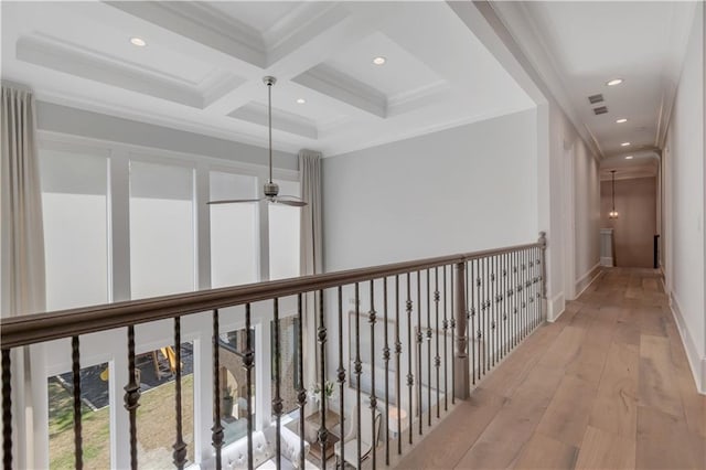 corridor featuring recessed lighting, light wood-style flooring, beam ceiling, coffered ceiling, and ornamental molding