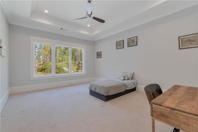carpeted bedroom with recessed lighting, a tray ceiling, baseboards, and ceiling fan