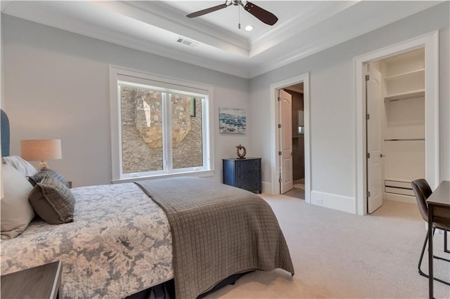 bedroom featuring light carpet, ornamental molding, a raised ceiling, recessed lighting, and baseboards