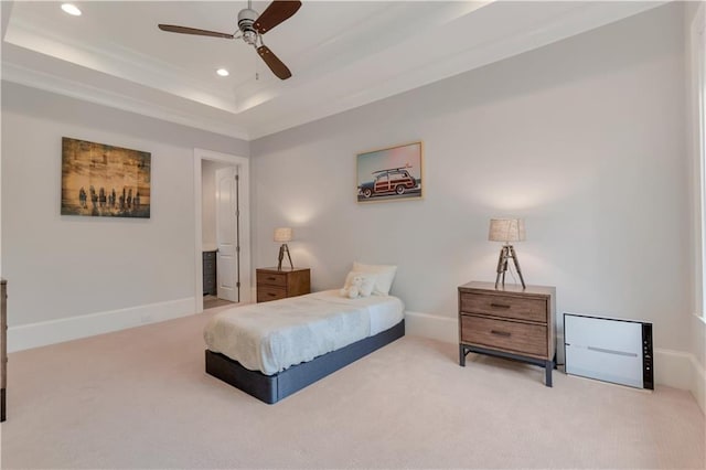 carpeted bedroom with recessed lighting, baseboards, a tray ceiling, and a ceiling fan