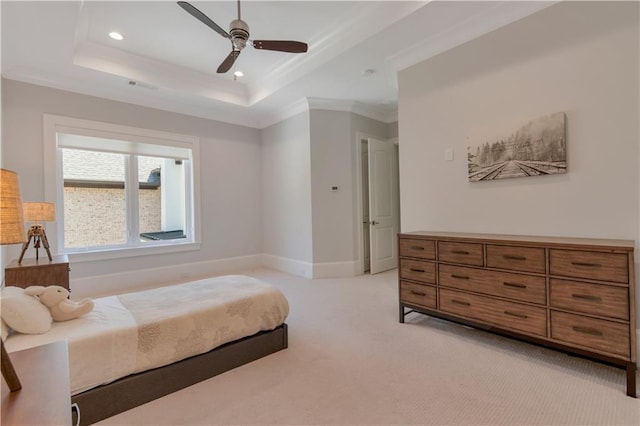bedroom with light colored carpet, a tray ceiling, ornamental molding, recessed lighting, and baseboards