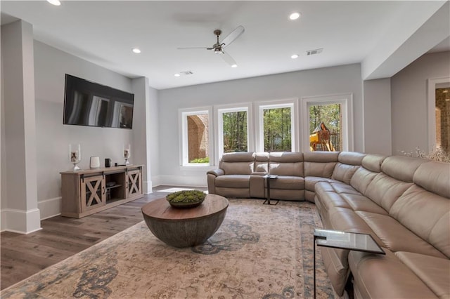 living room featuring wood finished floors, recessed lighting, a ceiling fan, plenty of natural light, and baseboards