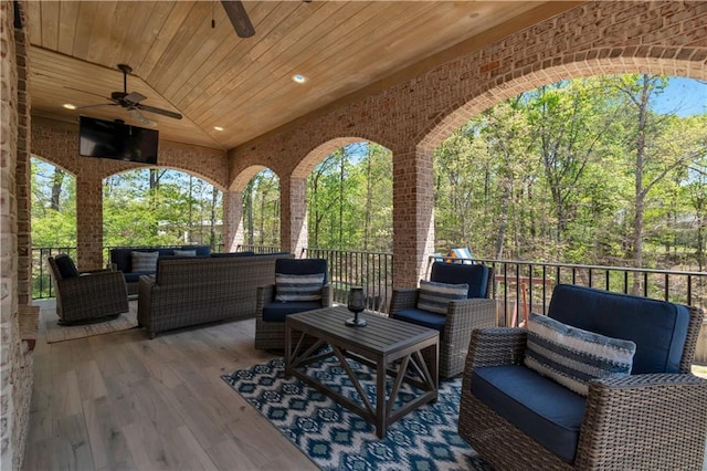 view of patio / terrace with an outdoor hangout area, ceiling fan, and a wooden deck