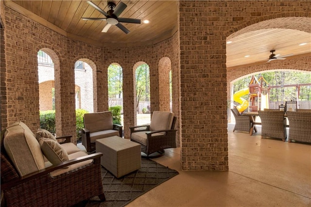 common area with brick wall, wooden ceiling, and recessed lighting