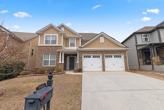 craftsman-style home featuring driveway, brick siding, and an attached garage