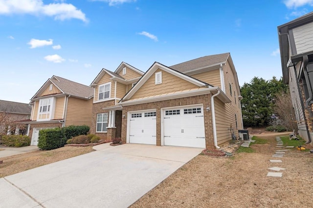 view of front of home featuring a garage, central AC, brick siding, and concrete driveway