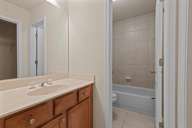 full bath with toilet, vanity, washtub / shower combination, and tile patterned floors