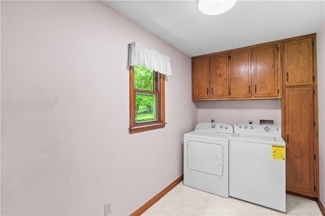 3802 SW Knights Bridge Rd SW, Lilburn, GA 30047 - laundry room featuring cabinet space, washing machine and clothes dryer, and baseboards