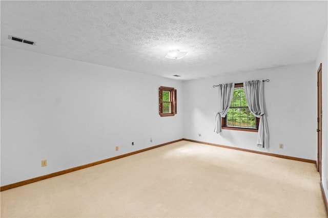3802 SW Knights Bridge Rd SW, Lilburn, GA 30047 - empty room with light colored carpet, baseboards, and a textured ceiling