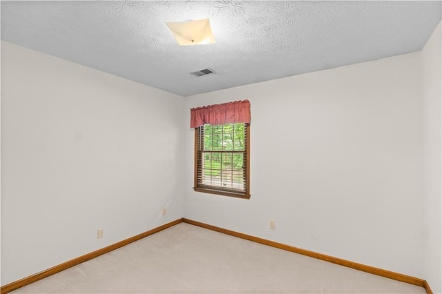 3802 SW Knights Bridge Rd SW, Lilburn, GA 30047 - empty room with light colored carpet, baseboards, and a textured ceiling