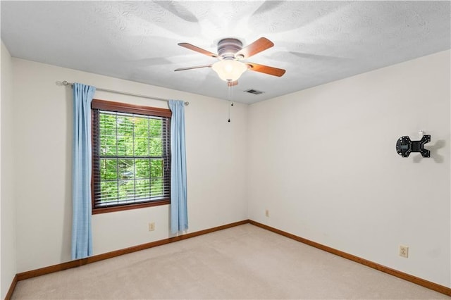 3802 SW Knights Bridge Rd SW, Lilburn, GA 30047 - unfurnished room featuring baseboards, light carpet, a ceiling fan, and a textured ceiling