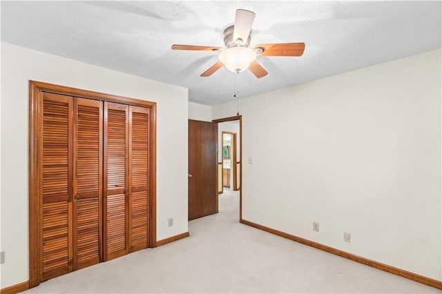 3802 SW Knights Bridge Rd SW, Lilburn, GA 30047 - unfurnished bedroom featuring light carpet, a closet, baseboards, and ceiling fan