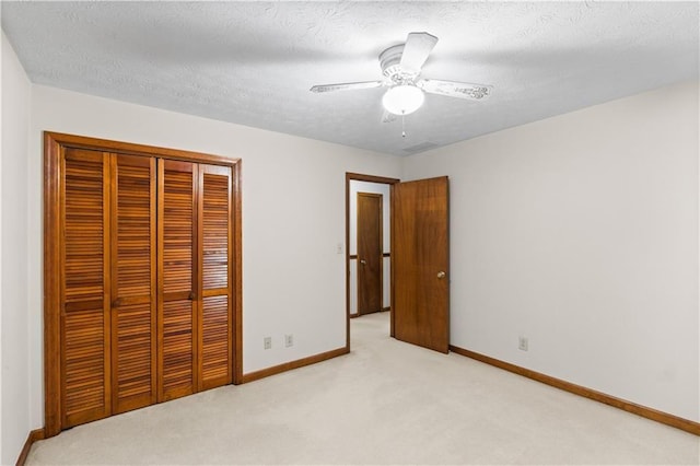 3802 SW Knights Bridge Rd SW, Lilburn, GA 30047 - unfurnished bedroom with light carpet, a closet, baseboards, and a ceiling fan