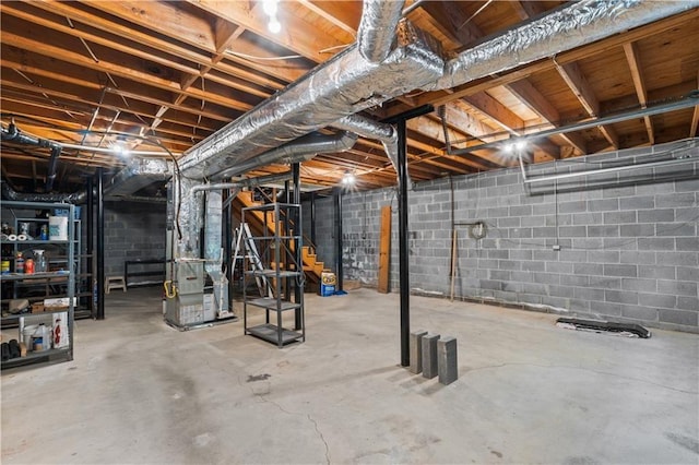 3802 SW Knights Bridge Rd SW, Lilburn, GA 30047 - unfinished basement with heating unit and concrete block wall