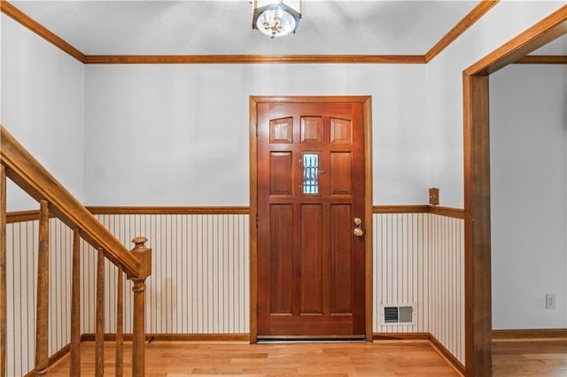 3802 SW Knights Bridge Rd SW, Lilburn, GA 30047 - foyer entrance with wood finished floors and crown molding