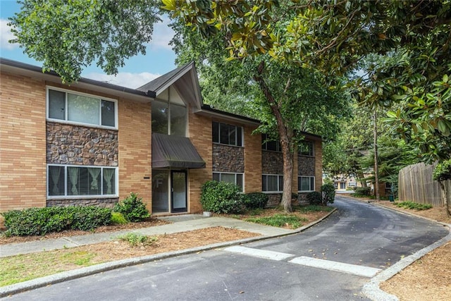 115 Biscayne Dr NW Unit F10, Atlanta, GA 30309 - view of property with stone siding and brick siding