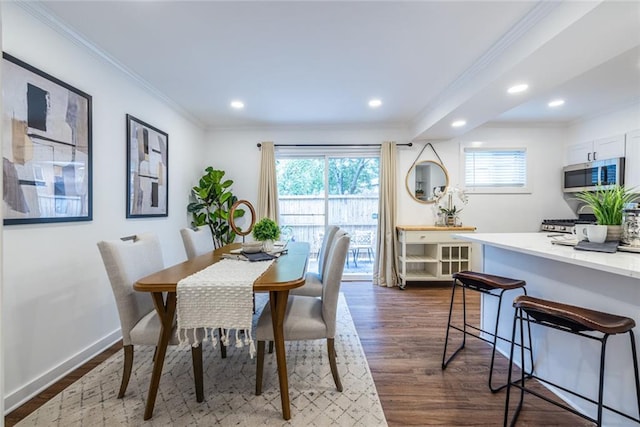 115 Biscayne Dr NW Unit F10, Atlanta, GA 30309 - dining area featuring crown molding, dark wood-style floors, recessed lighting, and baseboards