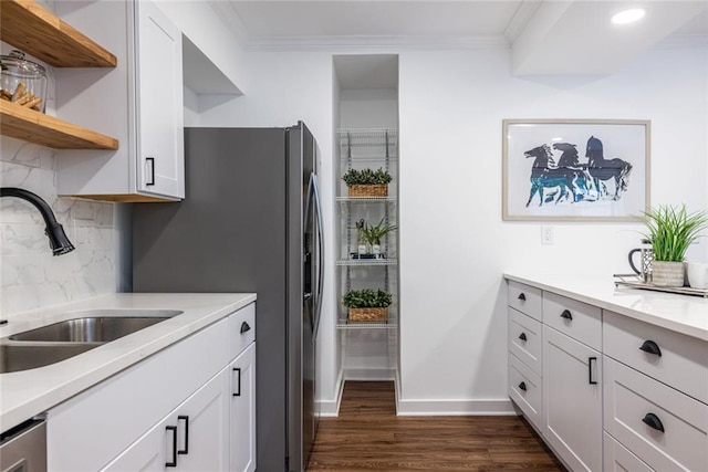 115 Biscayne Dr NW Unit F10, Atlanta, GA 30309 - kitchen with a sink, dark wood-style flooring, tasteful backsplash, open shelves, and ornamental molding