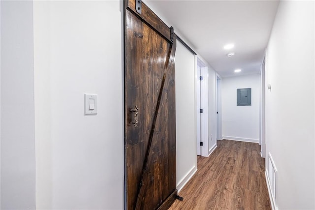 115 Biscayne Dr NW Unit F10, Atlanta, GA 30309 - hall featuring electric panel, wood finished floors, a barn door, baseboards, and recessed lighting