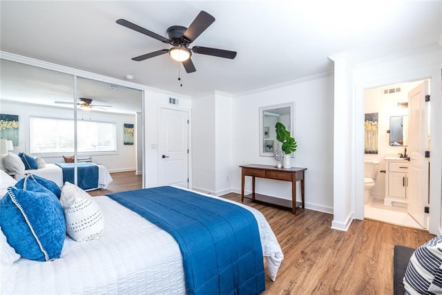 115 Biscayne Dr NW Unit F10, Atlanta, GA 30309 - bedroom with wood finished floors, crown molding, baseboards, and ceiling fan