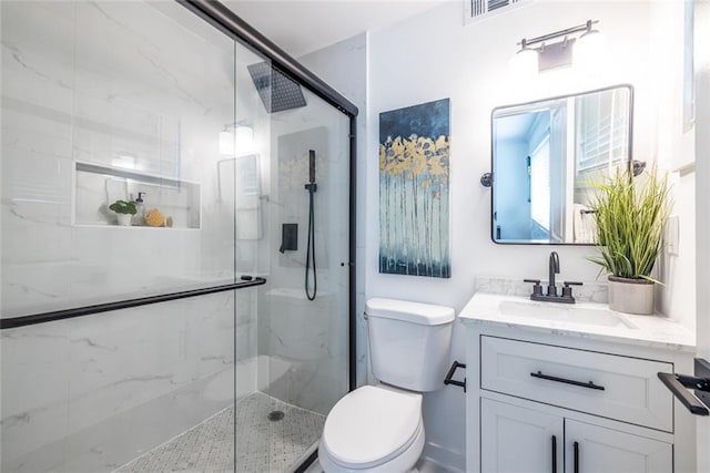 115 Biscayne Dr NW Unit F10, Atlanta, GA 30309 - full bathroom featuring toilet, a marble finish shower, and vanity
