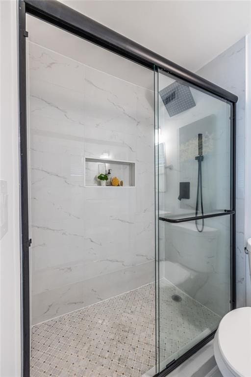 115 Biscayne Dr NW Unit F10, Atlanta, GA 30309 - bathroom featuring toilet and a marble finish shower