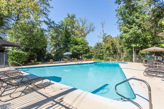 115 Biscayne Dr NW Unit F10, Atlanta, GA 30309 - community pool with a patio area and view of scattered trees