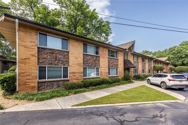 115 Biscayne Dr NW Unit F10, Atlanta, GA 30309 - view of front of home featuring stone siding and brick siding
