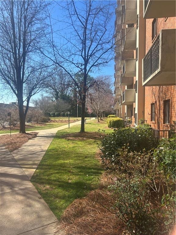 view of community featuring a yard