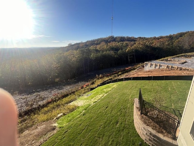 view of yard featuring a view of trees