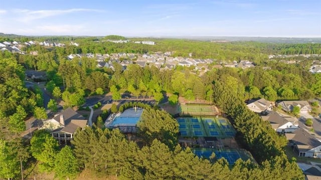 birds eye view of property featuring a forest view and a residential view