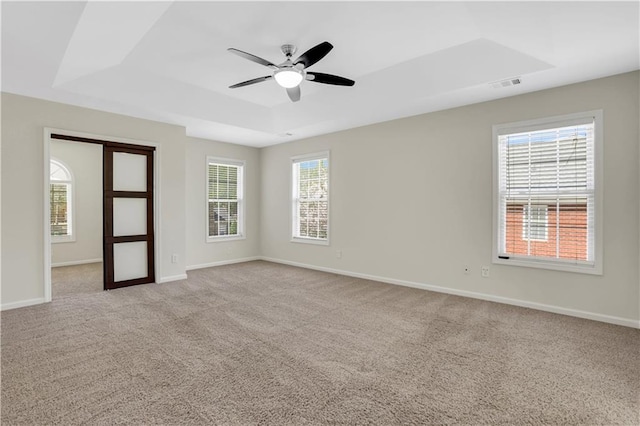 3485 Walnut Rdg, Atlanta, GA 30349 - empty room with a raised ceiling, ceiling fan, carpet, and baseboards
