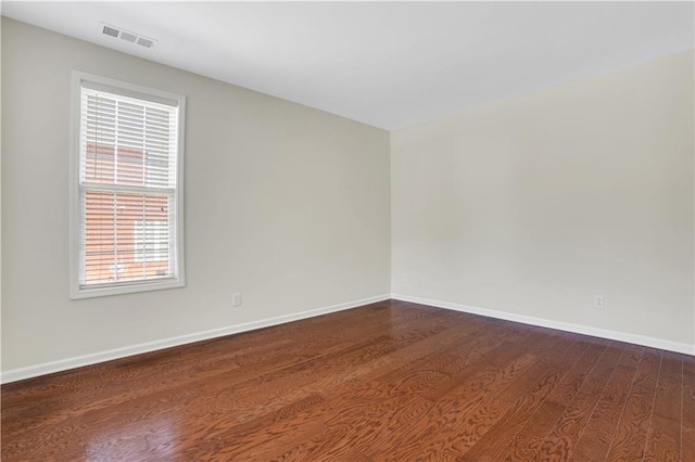 3485 Walnut Rdg, Atlanta, GA 30349 - spare room featuring dark wood finished floors and baseboards