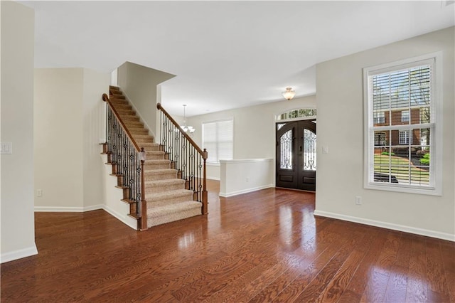 3485 Walnut Rdg, Atlanta, GA 30349 - foyer entrance with french doors, stairway, wood finished floors, and healthy amount of natural light