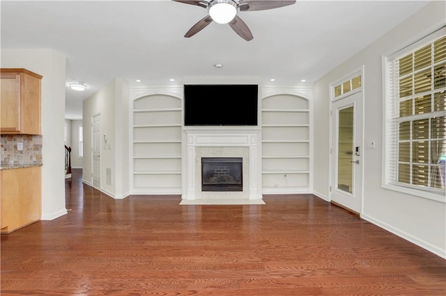 3485 Walnut Rdg, Atlanta, GA 30349 - unfurnished living room with ceiling fan, a fireplace with flush hearth, built in features, and wood finished floors