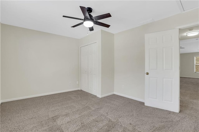 3485 Walnut Rdg, Atlanta, GA 30349 - unfurnished bedroom with carpet flooring, a closet, baseboards, and a ceiling fan