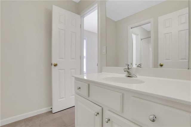 3485 Walnut Rdg, Atlanta, GA 30349 - bathroom with baseboards, tile patterned floors, and vanity