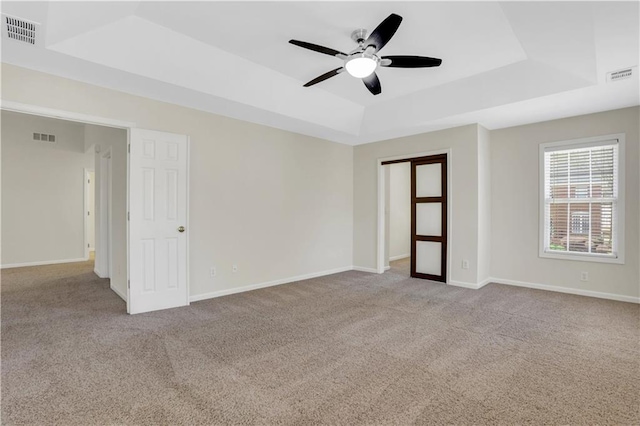 3485 Walnut Rdg, Atlanta, GA 30349 - spare room with a raised ceiling, ceiling fan, and carpet flooring