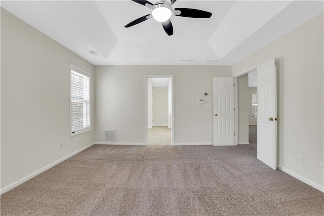3485 Walnut Rdg, Atlanta, GA 30349 - carpeted empty room with a tray ceiling, a ceiling fan, and baseboards