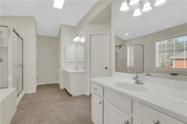 3485 Walnut Rdg, Atlanta, GA 30349 - bathroom with a stall shower, vaulted ceiling, two vanities, and baseboards