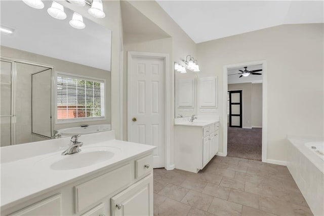 3485 Walnut Rdg, Atlanta, GA 30349 - bathroom featuring a bath, a shower stall, two vanities, and baseboards