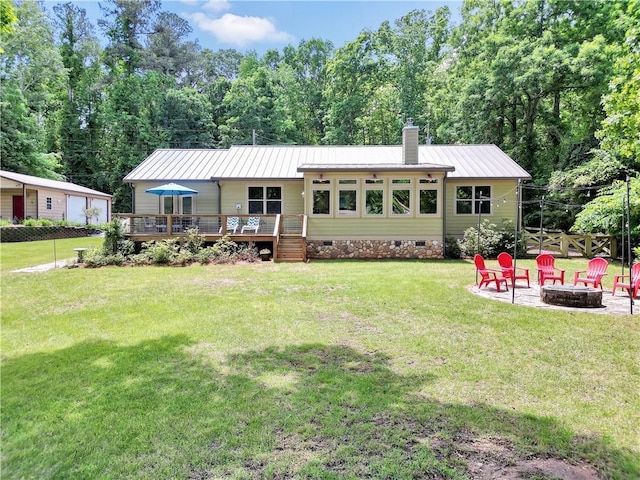 184 Bradley Rd, Jackson, GA 30233 - rear view of property with a fire pit, a deck, a chimney, crawl space, and metal roof
