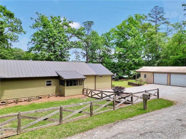 184 Bradley Rd, Jackson, GA 30233 - ranch-style house featuring metal roof, a garage, and an outdoor structure