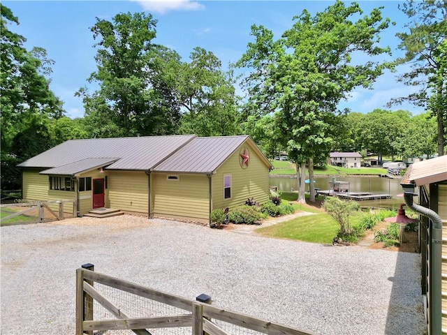184 Bradley Rd, Jackson, GA 30233 - view of front facade featuring metal roof and gravel driveway