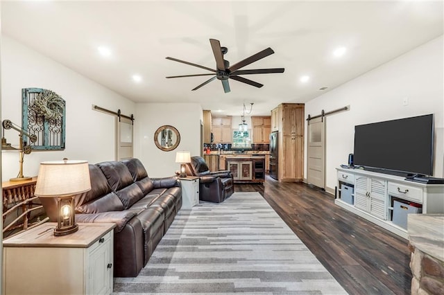 184 Bradley Rd, Jackson, GA 30233 - living room featuring a barn door, ceiling fan, dark wood finished floors, and recessed lighting