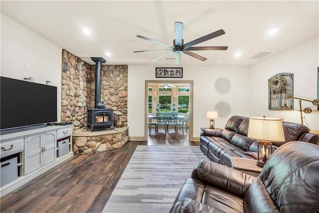 184 Bradley Rd, Jackson, GA 30233 - living room with a ceiling fan, a wood stove, dark wood-style floors, and recessed lighting