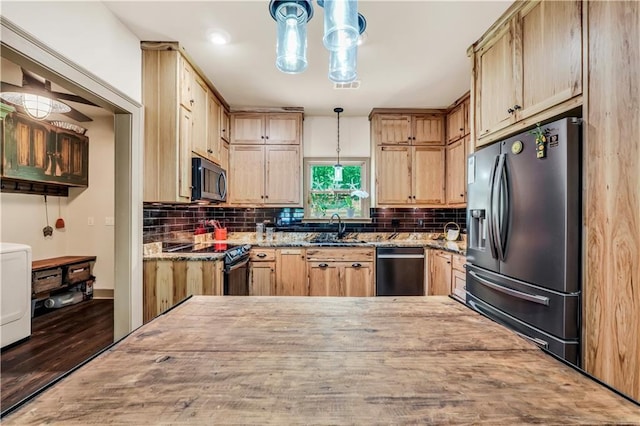 184 Bradley Rd, Jackson, GA 30233 - kitchen with appliances with stainless steel finishes, washer / dryer, light stone countertops, a sink, and light brown cabinets