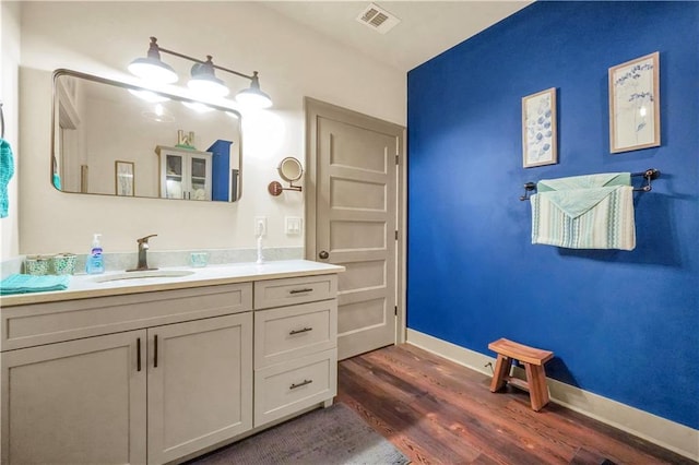184 Bradley Rd, Jackson, GA 30233 - bathroom featuring wood finished floors, vanity, and baseboards