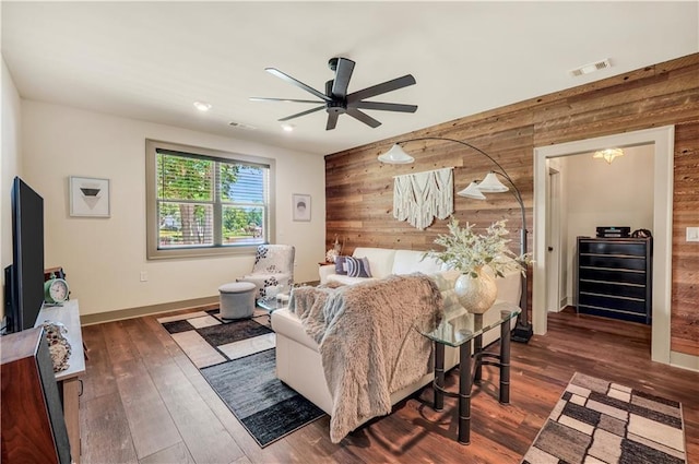 184 Bradley Rd, Jackson, GA 30233 - bedroom featuring wooden walls, dark wood-type flooring, baseboards, and a ceiling fan
