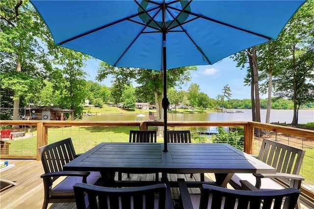 184 Bradley Rd, Jackson, GA 30233 - wooden terrace featuring a water view, outdoor dining area, a yard, and view of scattered trees